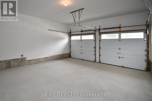 56 Bearberry Road, Springwater, ON - Indoor Photo Showing Garage