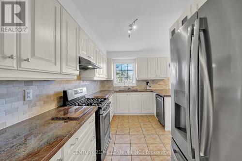 63 - 9800 Mclaughlin Road N, Brampton, ON - Indoor Photo Showing Kitchen With Stainless Steel Kitchen With Double Sink With Upgraded Kitchen