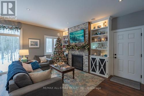 316 1/2 Riverside Drive, Kawartha Lakes (Bobcaygeon), ON - Indoor Photo Showing Living Room With Fireplace