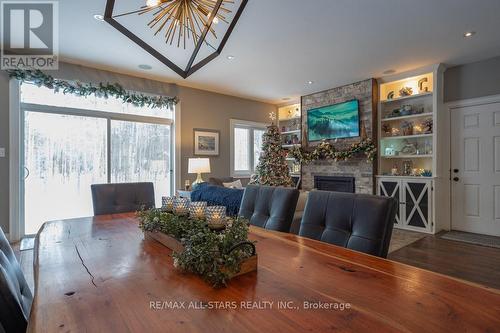 316 1/2 Riverside Drive, Kawartha Lakes (Bobcaygeon), ON - Indoor Photo Showing Dining Room With Fireplace