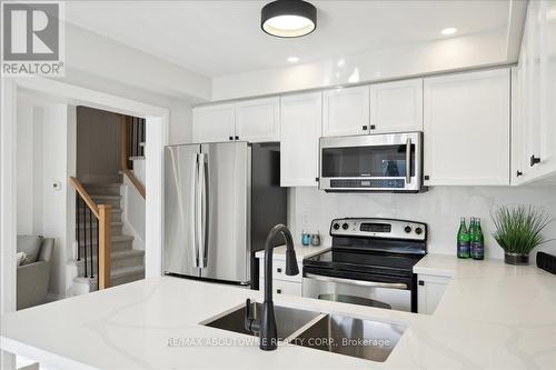 4880 Verdi Street, Burlington, ON - Indoor Photo Showing Kitchen With Stainless Steel Kitchen With Double Sink With Upgraded Kitchen