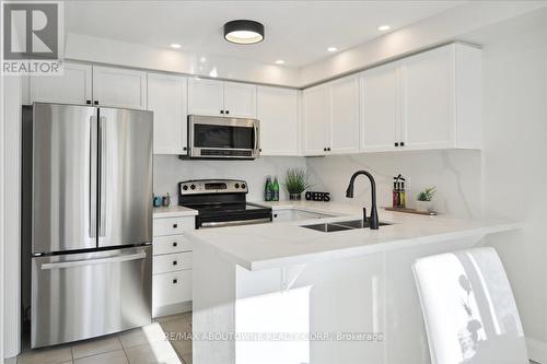 4880 Verdi Street, Burlington, ON - Indoor Photo Showing Kitchen With Stainless Steel Kitchen With Double Sink With Upgraded Kitchen