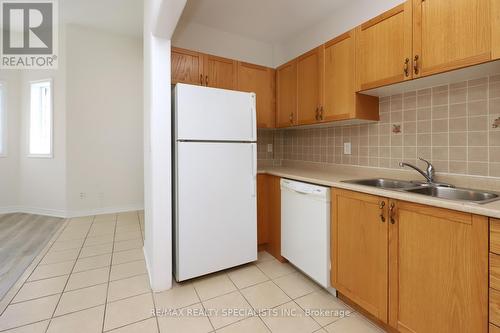 101 - 98 William Street, Mississauga, ON - Indoor Photo Showing Kitchen With Double Sink