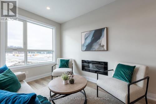 1865 Dalmagarry Road, London, ON - Indoor Photo Showing Living Room With Fireplace