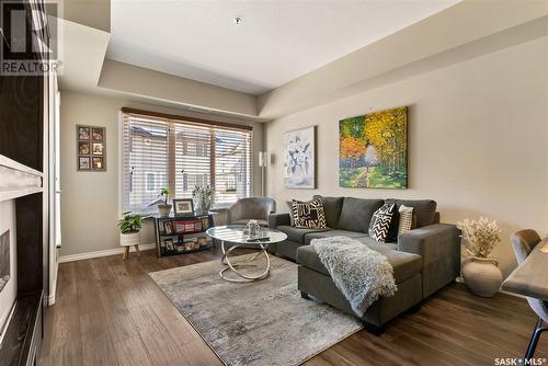 207 4501 Child Avenue, Regina, SK - Indoor Photo Showing Living Room With Fireplace