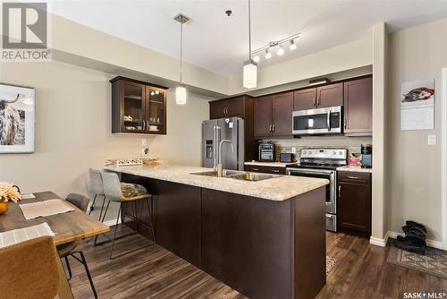 207 4501 Child Avenue, Regina, SK - Indoor Photo Showing Kitchen With Double Sink