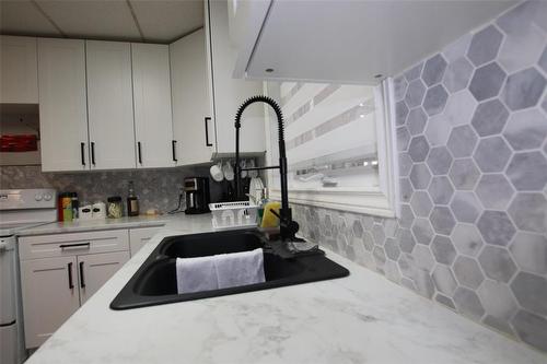 744 Cathedral Avenue, The Pas, MB - Indoor Photo Showing Kitchen With Double Sink