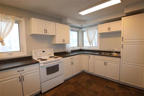 744 Cathedral Avenue, The Pas, MB - Indoor Photo Showing Kitchen With Double Sink