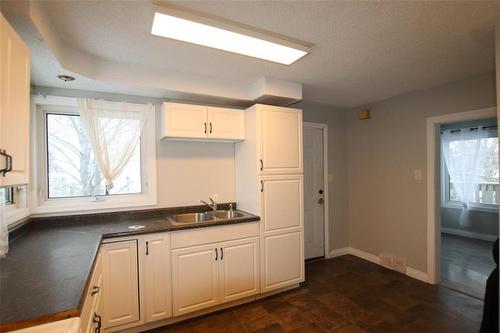 744 Cathedral Avenue, The Pas, MB - Indoor Photo Showing Kitchen With Double Sink