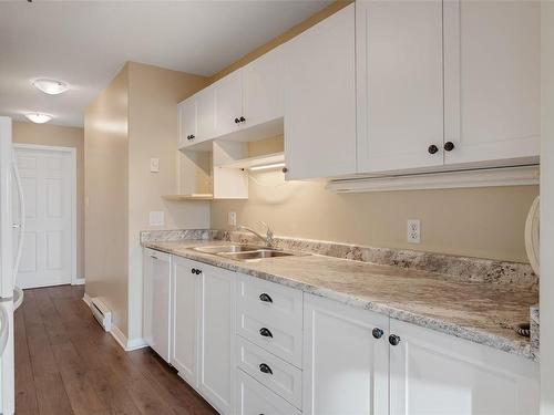 205-9711 Fifth St, Sidney, BC - Indoor Photo Showing Kitchen With Double Sink