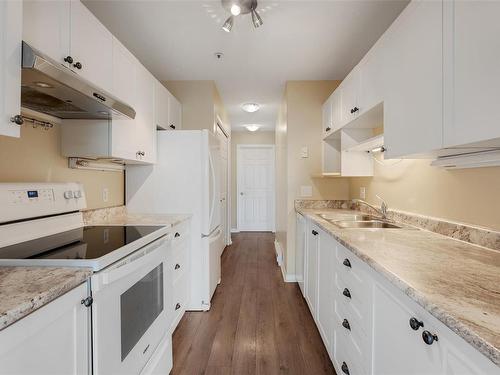 205-9711 Fifth St, Sidney, BC - Indoor Photo Showing Kitchen With Double Sink