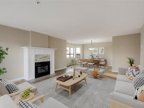 205-9711 Fifth St, Sidney, BC - Indoor Photo Showing Living Room With Fireplace