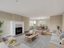 205-9711 Fifth St, Sidney, BC  - Indoor Photo Showing Living Room With Fireplace 