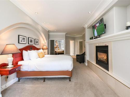 507/508C-366 Clubhouse Dr, Courtenay, BC - Indoor Photo Showing Bedroom With Fireplace