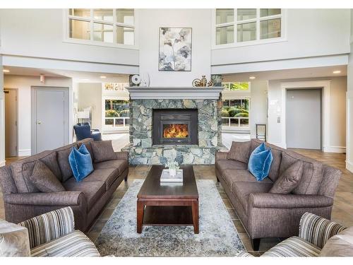 407-5650 Edgewater Lane, Nanaimo, BC - Indoor Photo Showing Living Room With Fireplace