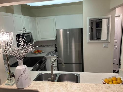 407-5650 Edgewater Lane, Nanaimo, BC - Indoor Photo Showing Kitchen With Double Sink With Upgraded Kitchen