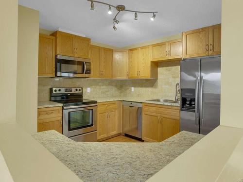 404-6715 Dover Rd, Nanaimo, BC - Indoor Photo Showing Kitchen With Stainless Steel Kitchen