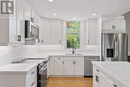 1 - 108 St Clair Avenue, Middlesex Centre (Komoka), ON - Indoor Photo Showing Kitchen With Double Sink With Upgraded Kitchen