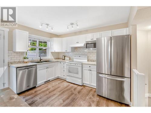 102 3825 Glen Canyon Drive, West Kelowna, BC - Indoor Photo Showing Kitchen With Double Sink