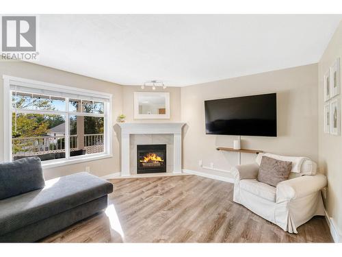 102 3825 Glen Canyon Drive, West Kelowna, BC - Indoor Photo Showing Living Room With Fireplace