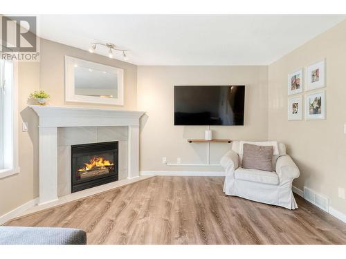 102 3825 Glen Canyon Drive, West Kelowna, BC - Indoor Photo Showing Living Room With Fireplace