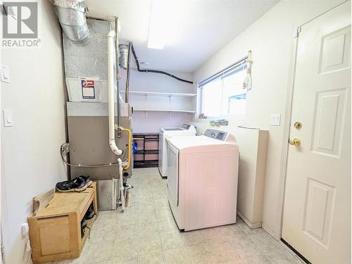 laundry and utility room with outside and garage exits - 2200 Leblanc Street, Lumby, BC - Indoor Photo Showing Laundry Room