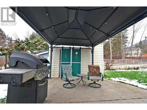 Concrete patio, shed with chicken coop included! - 2200 Leblanc Street, Lumby, BC - Outdoor With Exterior