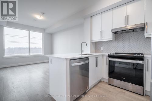 408 - 3220 William Coltson Avenue, Oakville, ON - Indoor Photo Showing Kitchen With Upgraded Kitchen