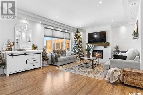 303 Waters Crescent, Saskatoon, SK - Indoor Photo Showing Living Room With Fireplace