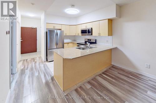 712 - 7405 Goreway Drive, Mississauga, ON - Indoor Photo Showing Kitchen With Double Sink