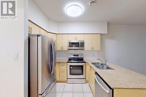 712 - 7405 Goreway Drive, Mississauga, ON - Indoor Photo Showing Kitchen With Double Sink