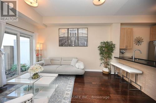 410 - 1360 Costigan Road, Milton, ON - Indoor Photo Showing Living Room