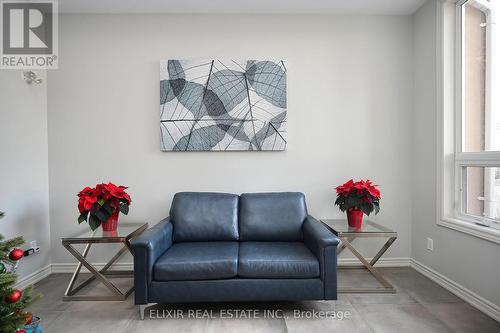 410 - 1360 Costigan Road, Milton, ON - Indoor Photo Showing Living Room