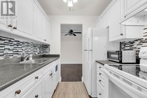 210 - 737 Deveron Crescent, London, ON - Indoor Photo Showing Kitchen With Double Sink