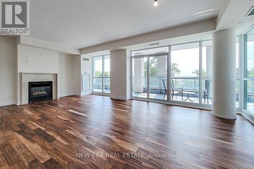 323 - 11 Bronte Road, Oakville, ON - Indoor Photo Showing Living Room With Fireplace