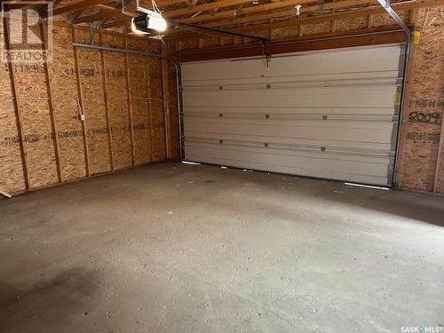 34 Bligh Bay, Regina, SK - Indoor Photo Showing Garage