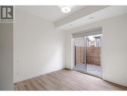 Bedroom #2 - a fantastic size with access to the fully fenced patio - 