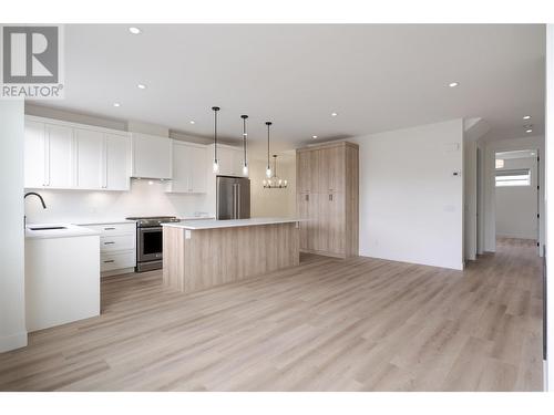 Stunning open concept living with high-end finishing and natural light throughout - 888 Patterson Avenue, Kelowna, BC - Indoor Photo Showing Kitchen With Upgraded Kitchen