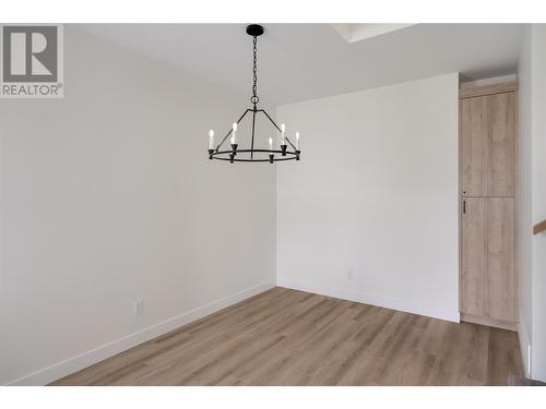 Formal dining space with storage - 888 Patterson Avenue, Kelowna, BC - Indoor Photo Showing Other Room