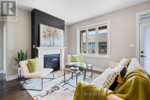 2 - 135 Borden Trail N, Welland, ON - Indoor Photo Showing Living Room With Fireplace