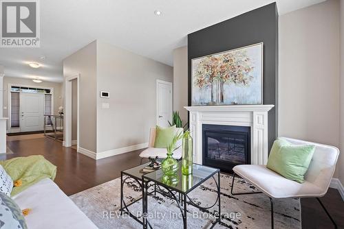 2 - 135 Borden Trail N, Welland, ON - Indoor Photo Showing Living Room With Fireplace