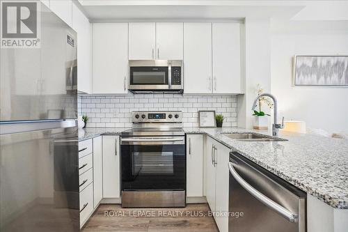 334 - 128 Grovewood Common, Oakville, ON - Indoor Photo Showing Kitchen With Stainless Steel Kitchen With Double Sink With Upgraded Kitchen