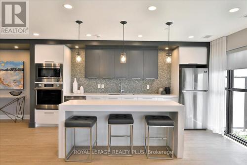 334 - 128 Grovewood Common, Oakville, ON - Indoor Photo Showing Kitchen With Stainless Steel Kitchen With Upgraded Kitchen