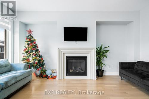 34 Periwinkle Road, Springwater, ON - Indoor Photo Showing Living Room With Fireplace