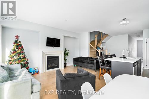 34 Periwinkle Road, Springwater, ON - Indoor Photo Showing Living Room With Fireplace