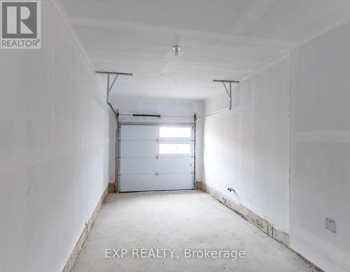 34 Periwinkle Road, Springwater, ON - Indoor Photo Showing Garage