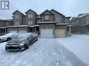 View of front of house featuring a garage - 11 Sorrento Street, Kitchener, ON  - Outdoor With Facade 