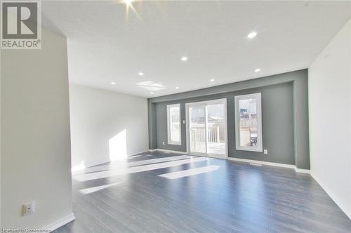 Spare room with dark hardwood / wood-style flooring - 11 Sorrento Street, Kitchener, ON - Indoor Photo Showing Other Room