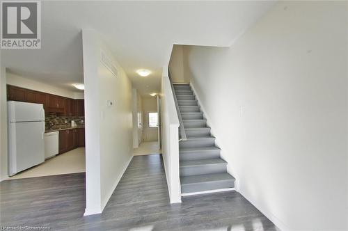 Stairway with hardwood / wood-style floors - 11 Sorrento Street, Kitchener, ON - Indoor Photo Showing Other Room