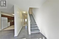 Stairway with hardwood / wood-style floors - 